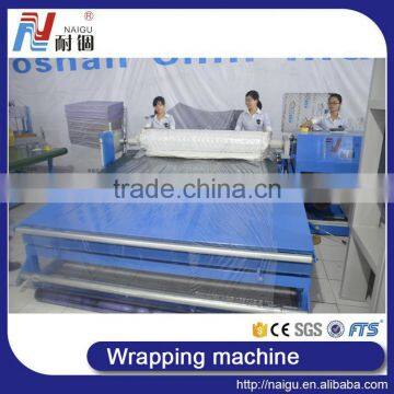 China Foshan NaiGu Manufacturer Semi-automatic Mattress Roll Packing Machine photo-2