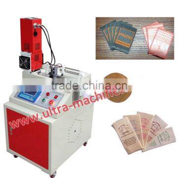 Ultrasonic clothing trademark cutting machine