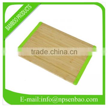 Bamboo cutting board with green rubber edge