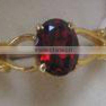 Gold Ring with Garnet Oval Cut