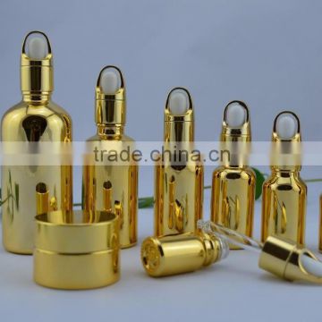 golden metal glass bottle with golden cap basket dropper fancy glass bottle