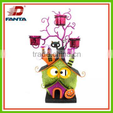 Animated metal Halloween house with glass votive candle holder