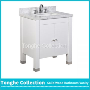 White freestanding bathroom vanity with carrara white marble top