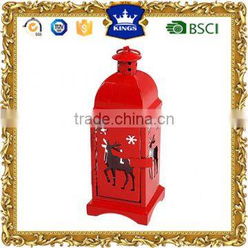 Small red metal candle lantern for christmas decoration with deer design