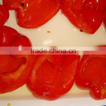 sweet red pepper halves in glass jar with high quality