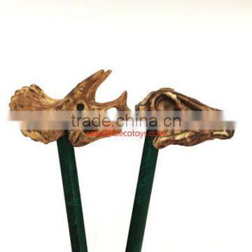 Dinosaur skull fossil pencil topper