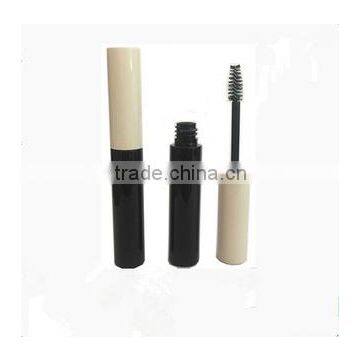 round black & white plastic mascara container