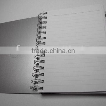 spiral metal notebook with ball pen