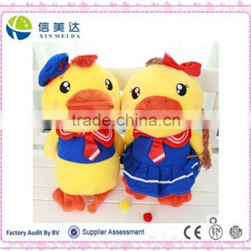 Plush big fat yellow duck in couple shows the love