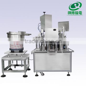 Automatic small bottle filling and capping machine