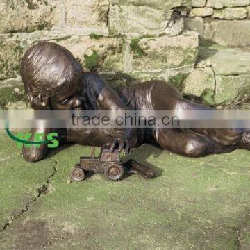 Bronze sculpture of boy with Tractor