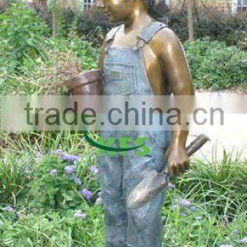 Bronze girl working in yard sculpture