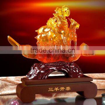 Coloured glaze goat with wood based desktop