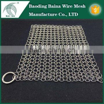 chain mail pan cleaner with Baina Company logo