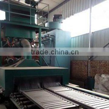 Continuous heating unit through conveyor polishing shot blaster