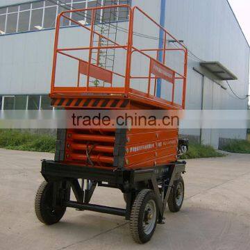 4 wheels movable scissor type hydraulic lift machine with low price