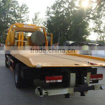 small flatbed towing truck