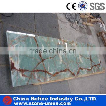 Green onyx slab with red grain