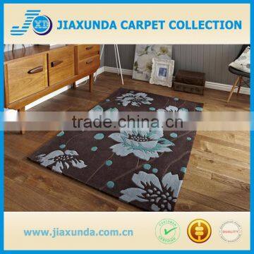 Brown/blue hand carved acrylic a bold floral pattern and stems in natural brown rug for living room