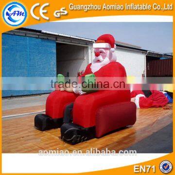 Outdoor inflatable christmas decoration sitting santa claus