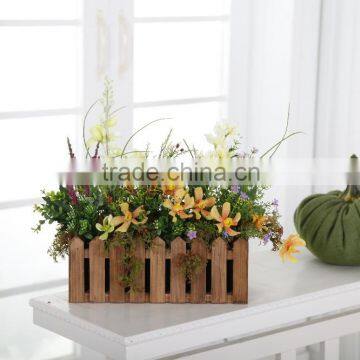 2015 Colorful tropical flower arrangement in Wooden fence flower pot