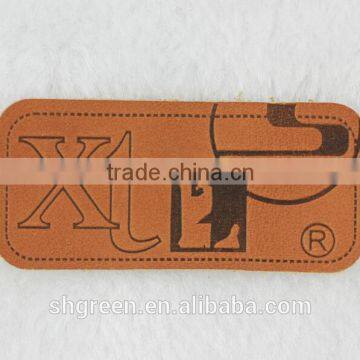 Embossed trademark genuine leather label in apparel