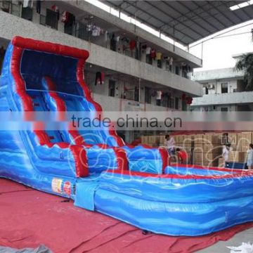 volcano lava themed inflatable water slide with a bigger water pool