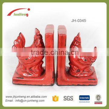 glazed red ceramic book holder stand, cock double for bookends