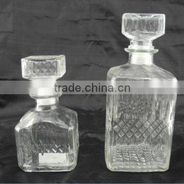 square glass wisky russian liqueur bottle with lid