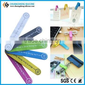 Multifunctional magnetic silicone cable clip, mobile phone holders