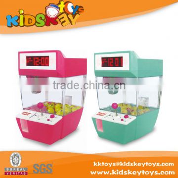 2015 Funny kids family mini toy crane machine with funny alarm clock for sale