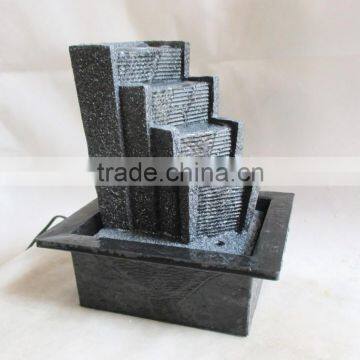 Resin table fountain with ladder statue