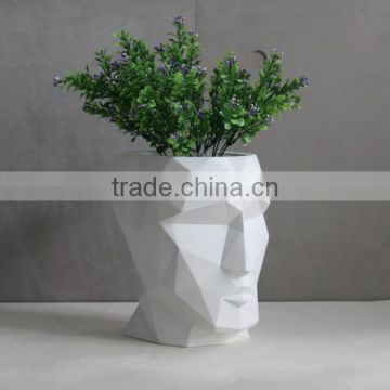 White Man face geometry concrete planter pot