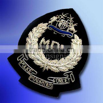 Mauritius P F cap badge