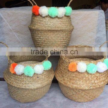 High quality best selling eco-friendly Natural seagrass baskets with colored pompoms from Vietnam