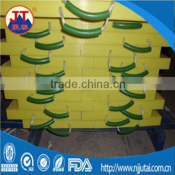 Yellow uhmwpe truck loading outrigger pads with handle