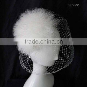 Gorgeous white feather fascinator with birdcage veil