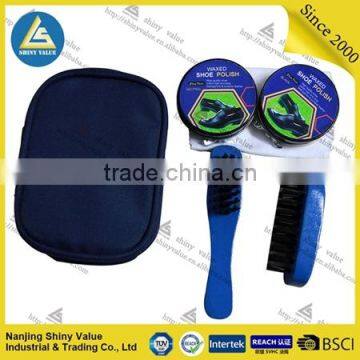 portable travel use shoe shine kit with plastic shoe horn and tin shoe polish