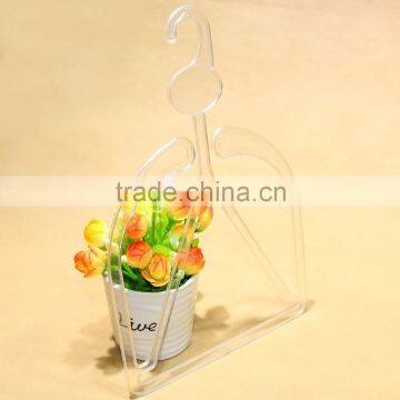 Transparent plastic clothes hanger for hats