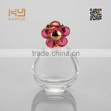 small cute cubic perfume bottle with red flower cap