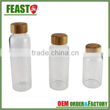 high borosilicate glass water bottle with bamboo lid and lifting rope
