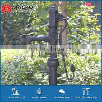 europrean older style water feature cast iron spout hand pump