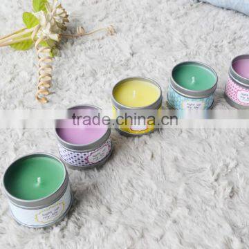 Multi-colored scented tin candles with metal lid