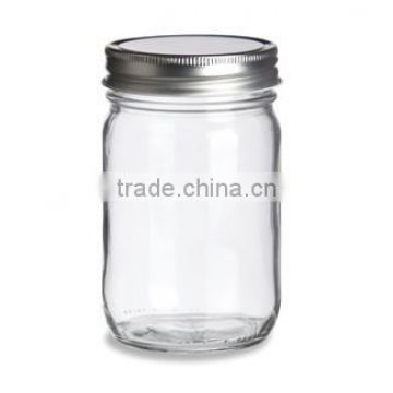 Empty glass honey jar