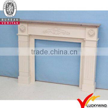 White antique decorative wooden fireplace