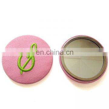 Circular badge mirror/make-up mirror