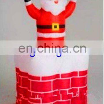 inflatable santa in chimney with light