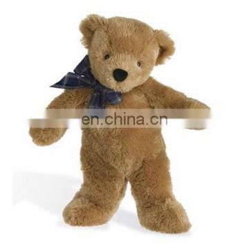 Christmas teddy bear with a blue bowknot