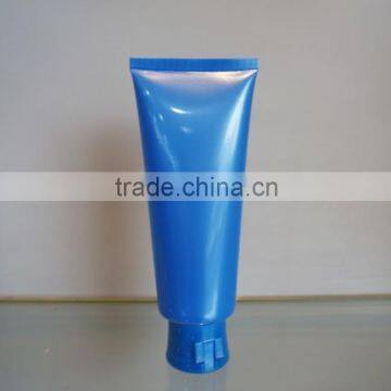 plastic tube with oriented flip-top cap