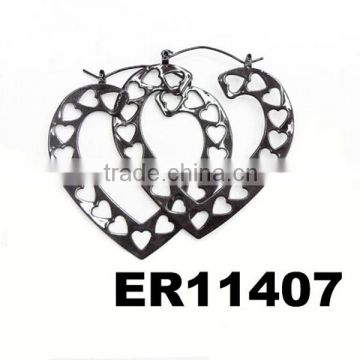 women heart shaped black metal earrings